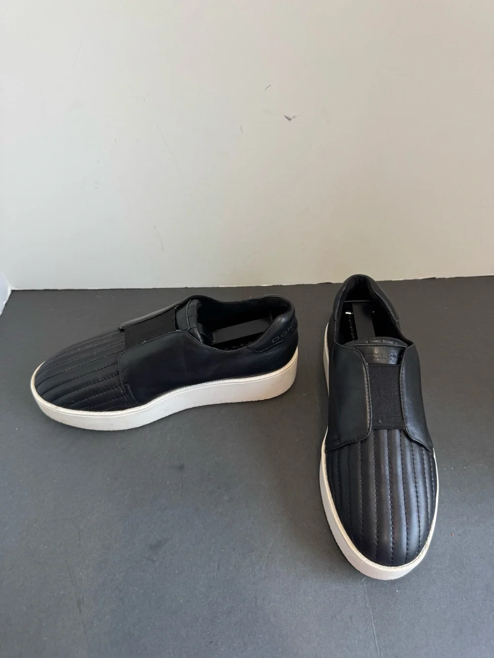 Donna Karan New York black leather slip-on sneakers. Size 6